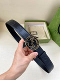 Gucci dark navy leather belt with GG-pattern buckle in silver and gold-tone