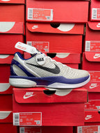 White and blue basketball sneaker with black swoosh and 'MAX' heel detail.