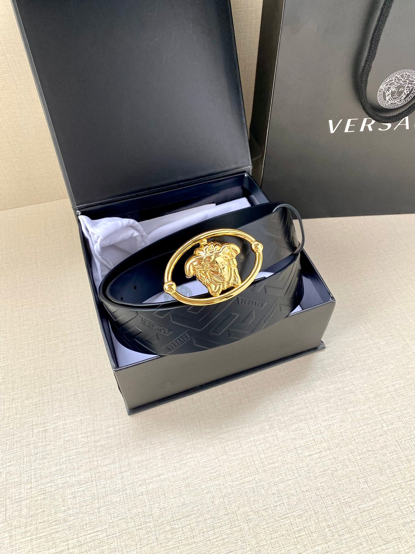 Versace belt in box, dark blue embossed leather with gold-tone oval lion buckle