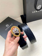 Black belt with embossed texture and silver-tone Medusa oval buckle