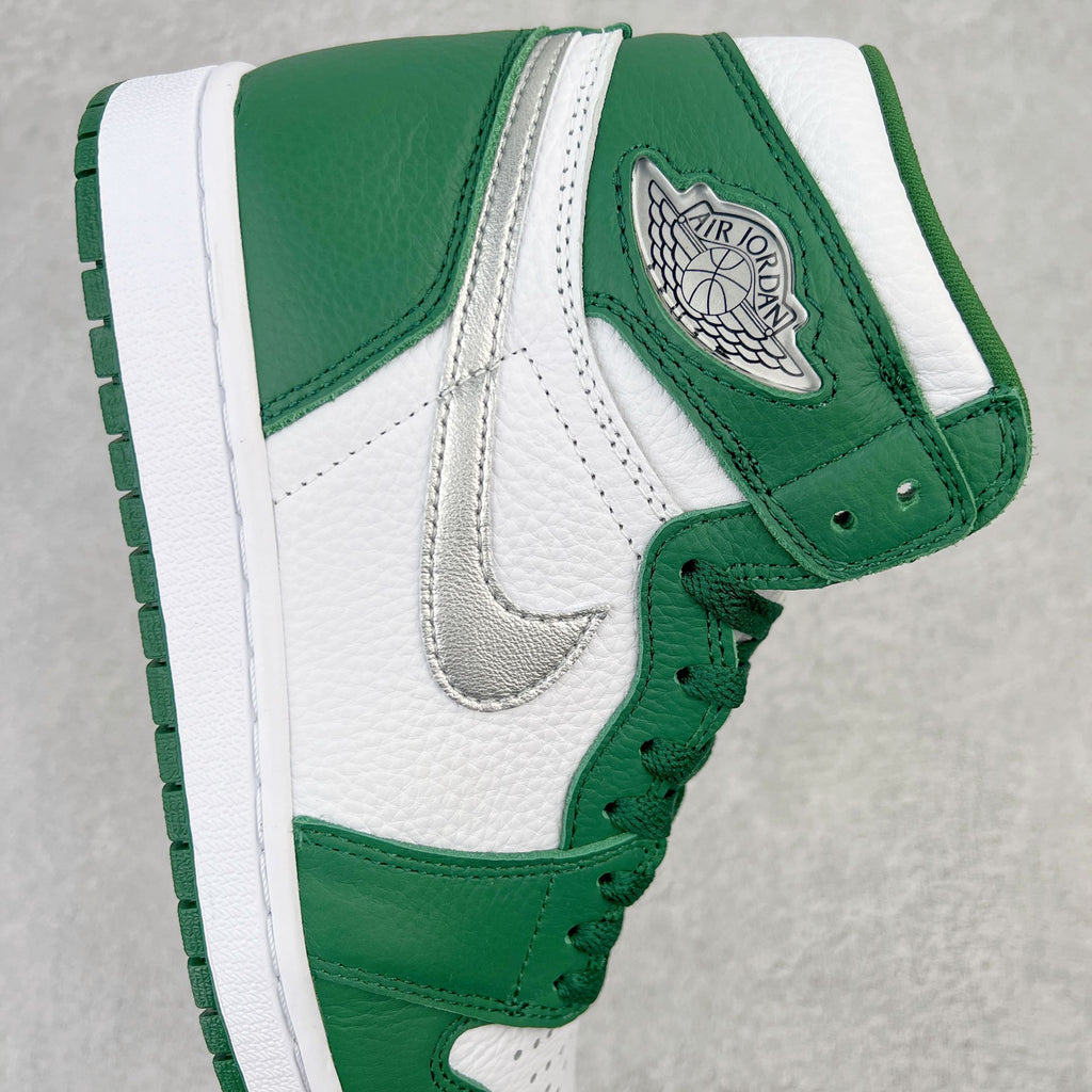 Green and white high-top sneaker side with Swoosh and Air Jordan Wings patch