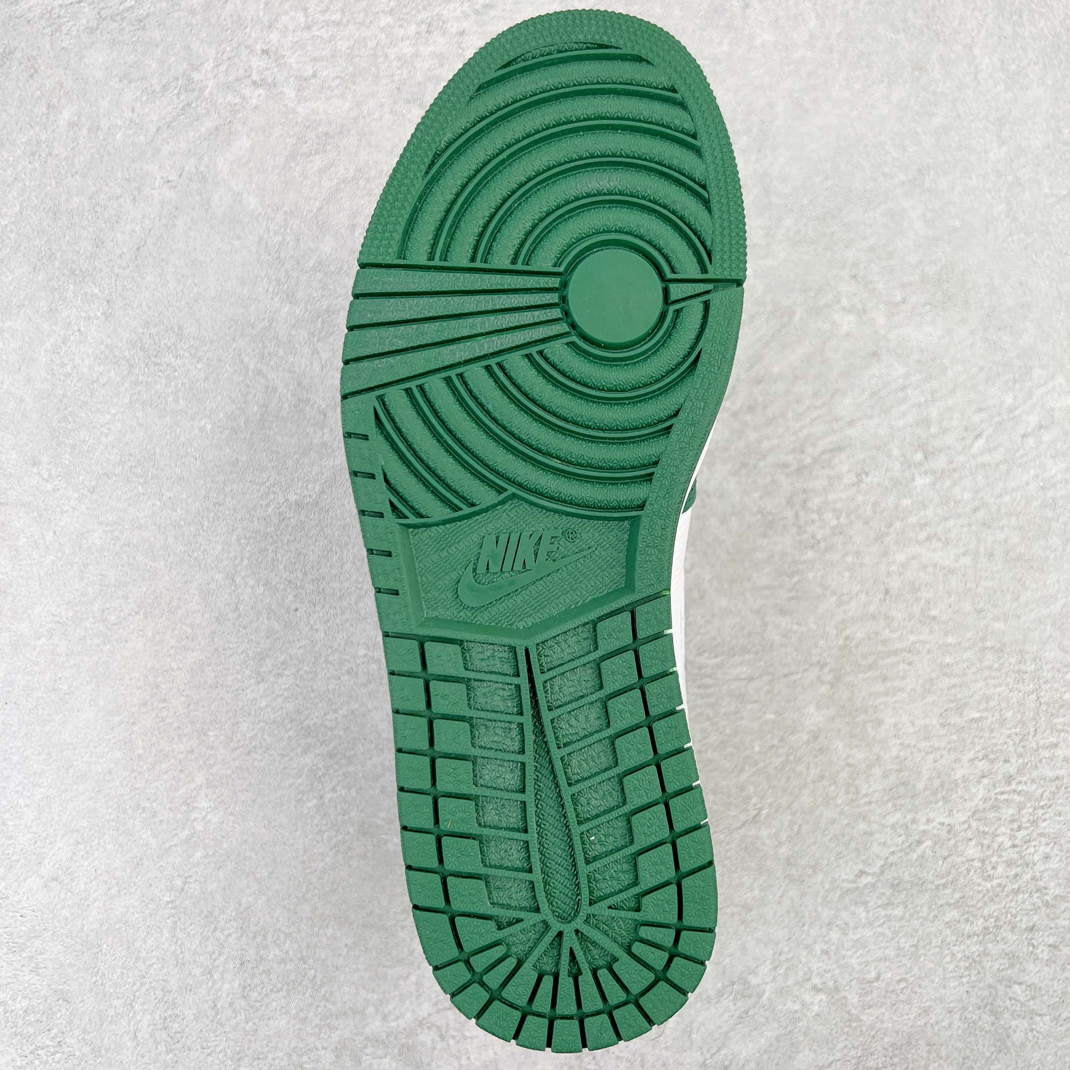 Green rubber outsole for high-top sneaker with traction pattern and Nike logo