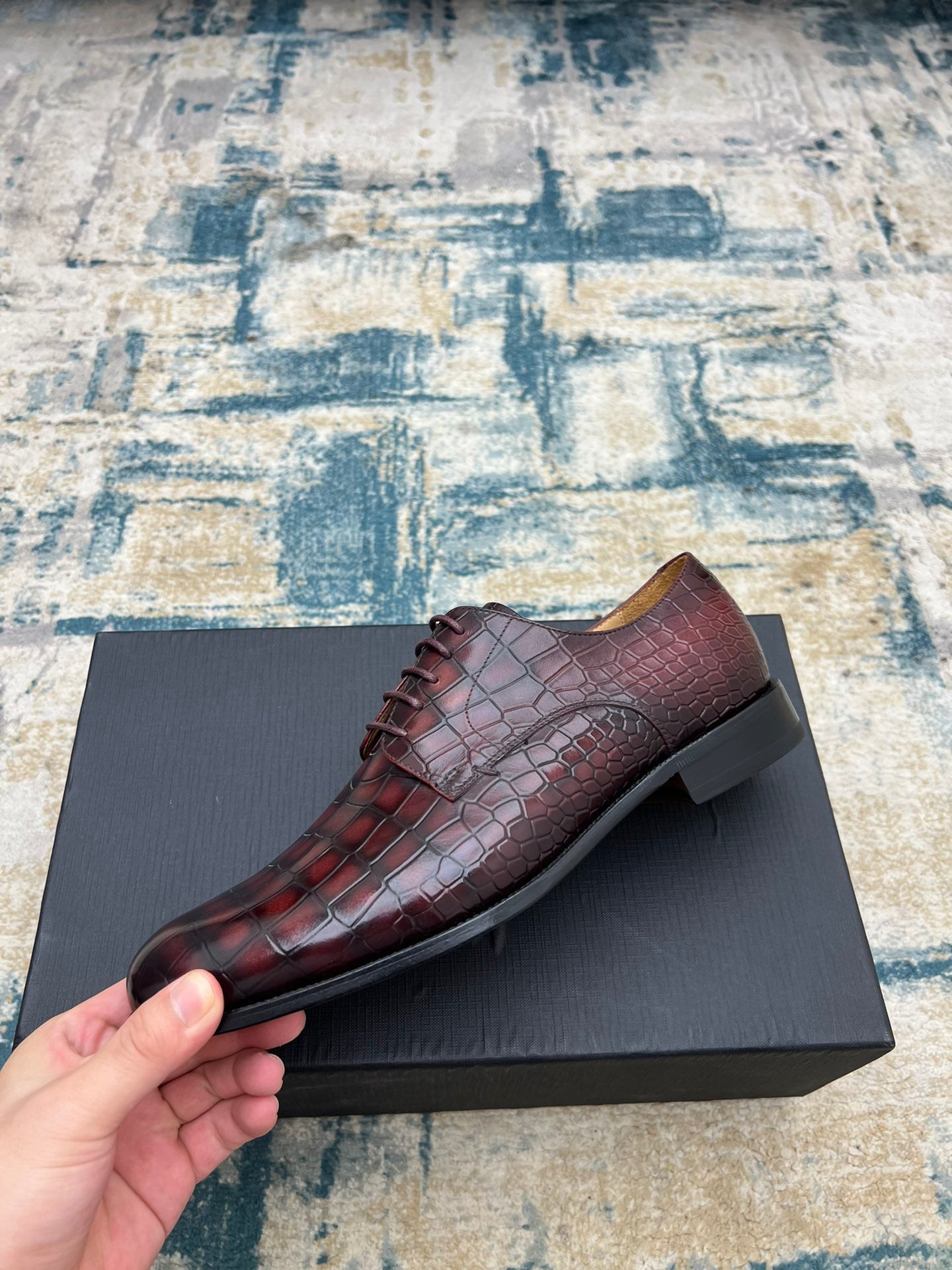 Dior unisex lace-up dress shoe in burgundy crocodile-embossed leather, side angle