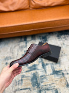 Dior unisex lace-up dress shoe in burgundy crocodile-embossed leather, side view