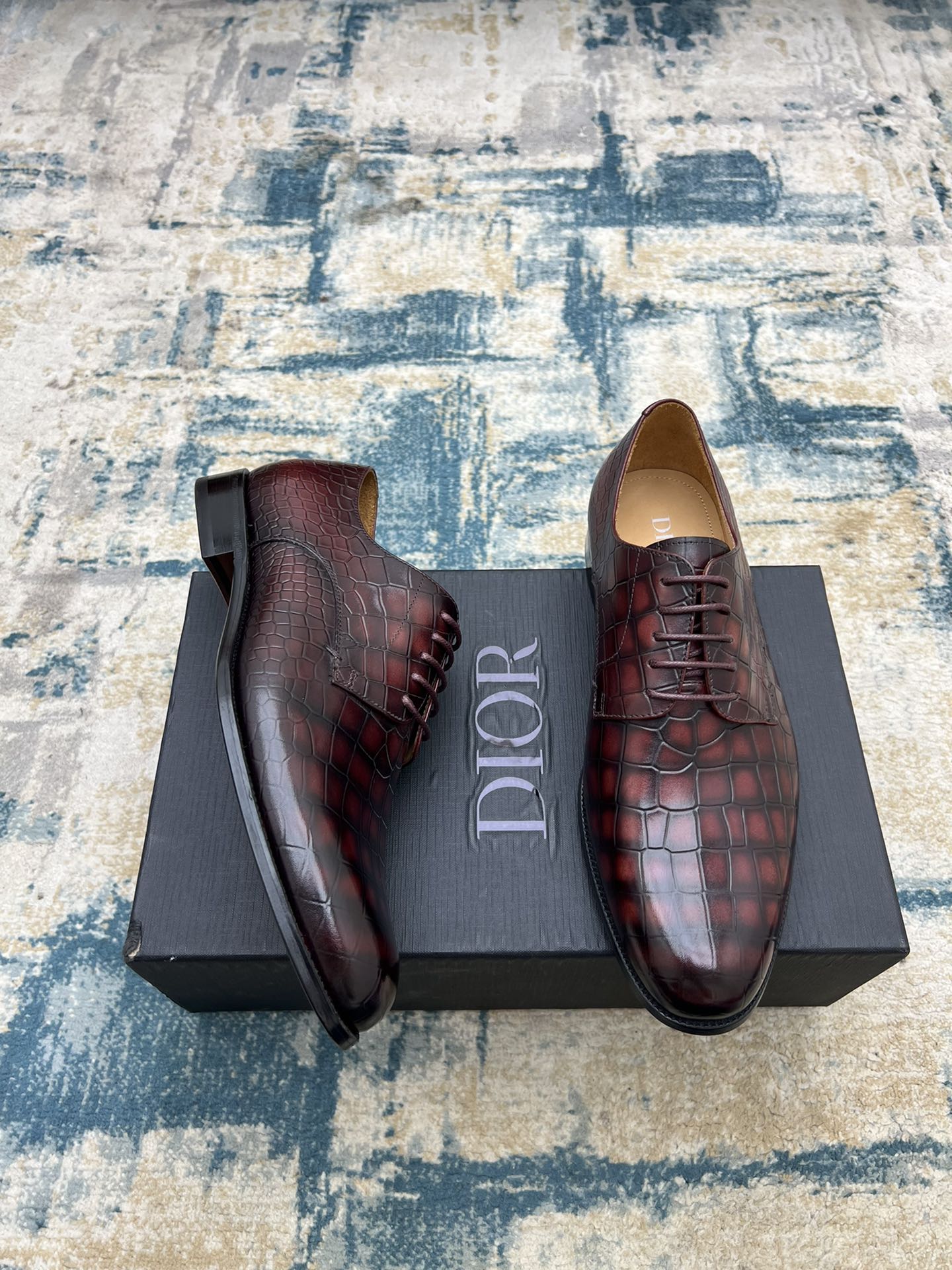 Dior unisex lace-up dress shoes in burgundy crocodile-embossed leather, side view