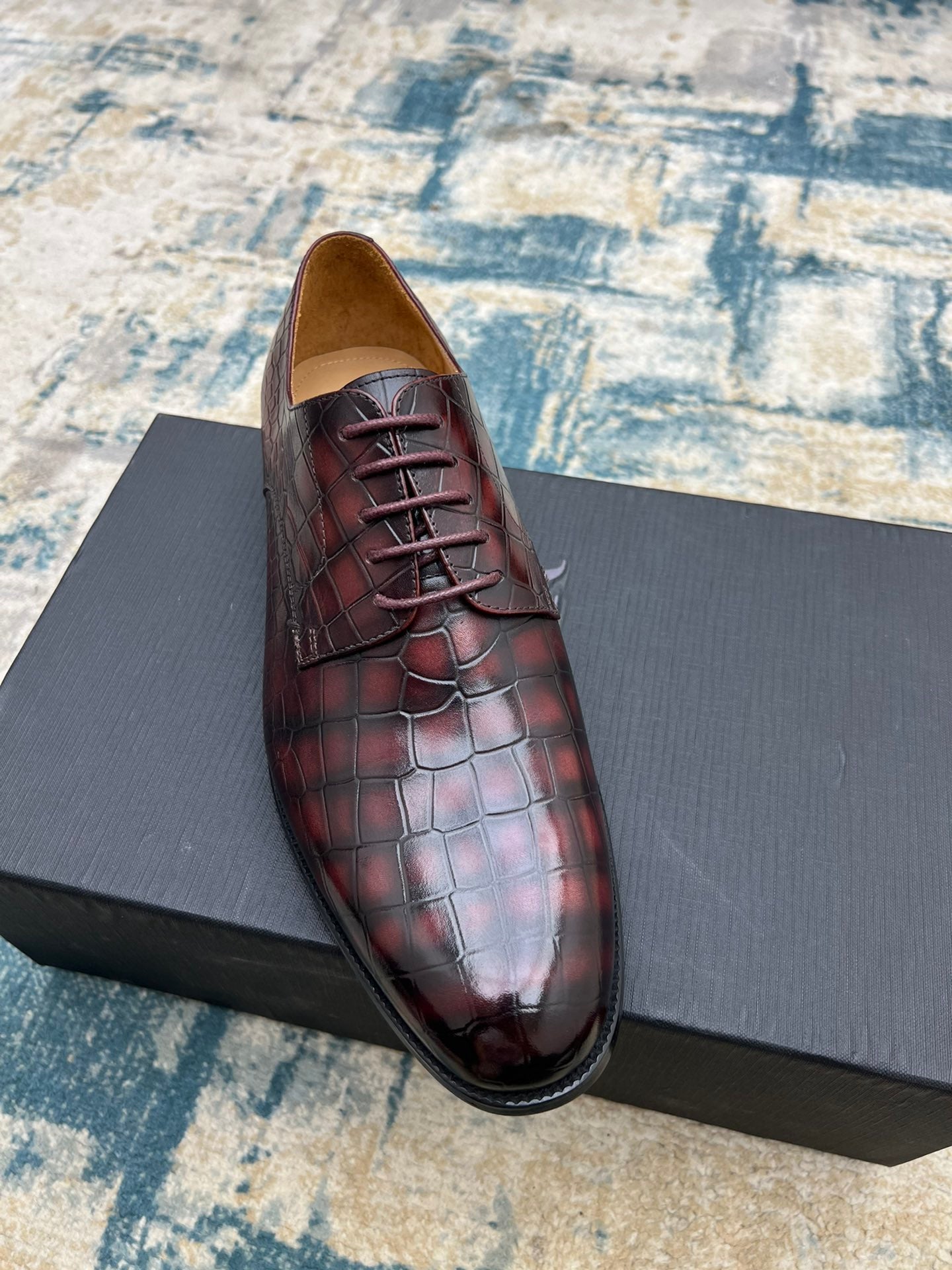 Dior unisex lace-up dress shoe in burgundy crocodile-embossed leather, front angle