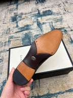 Black leather shoe sole with tan interior lining, lace-up dress shoes