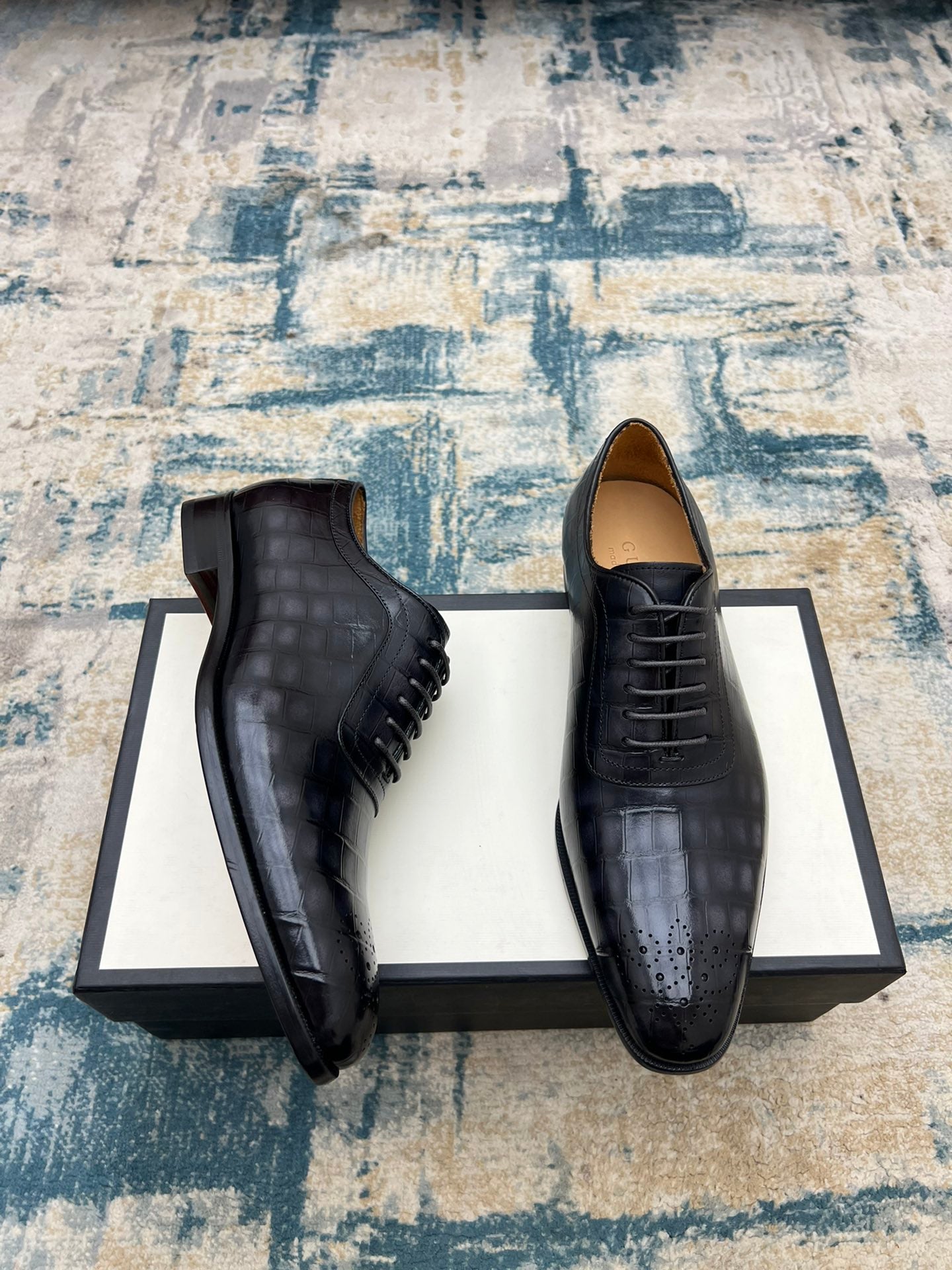 Black leather lace-up dress shoes, side view with stitched detailing