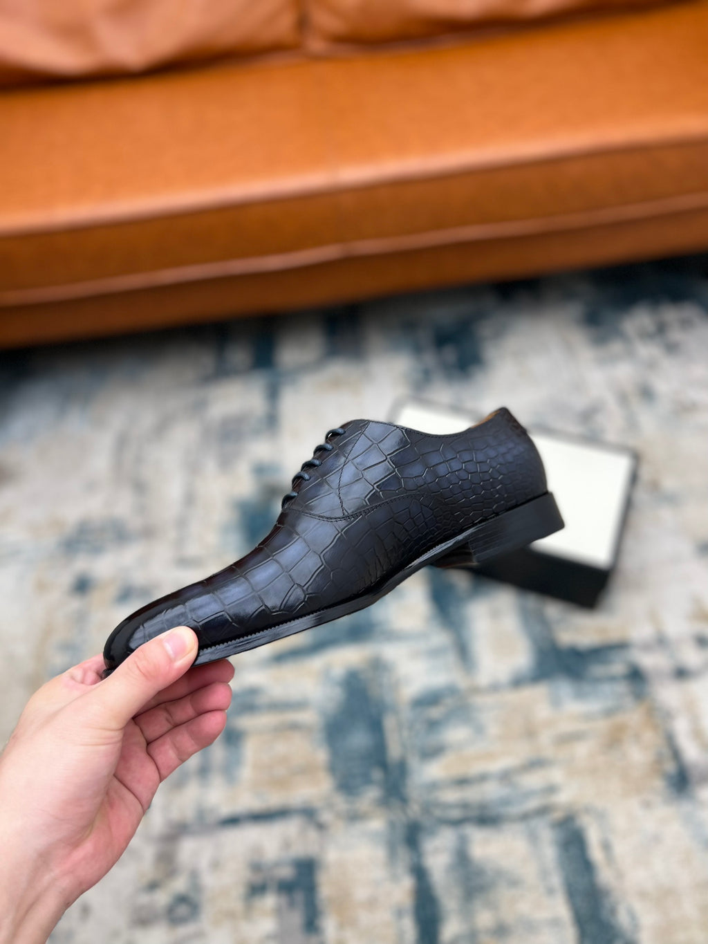 Gucci unisex leather lace-up shoe, black croc-texture, angled side view