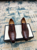 Gucci unisex leather lace-up dress shoes, dark brown textured finish, pair view