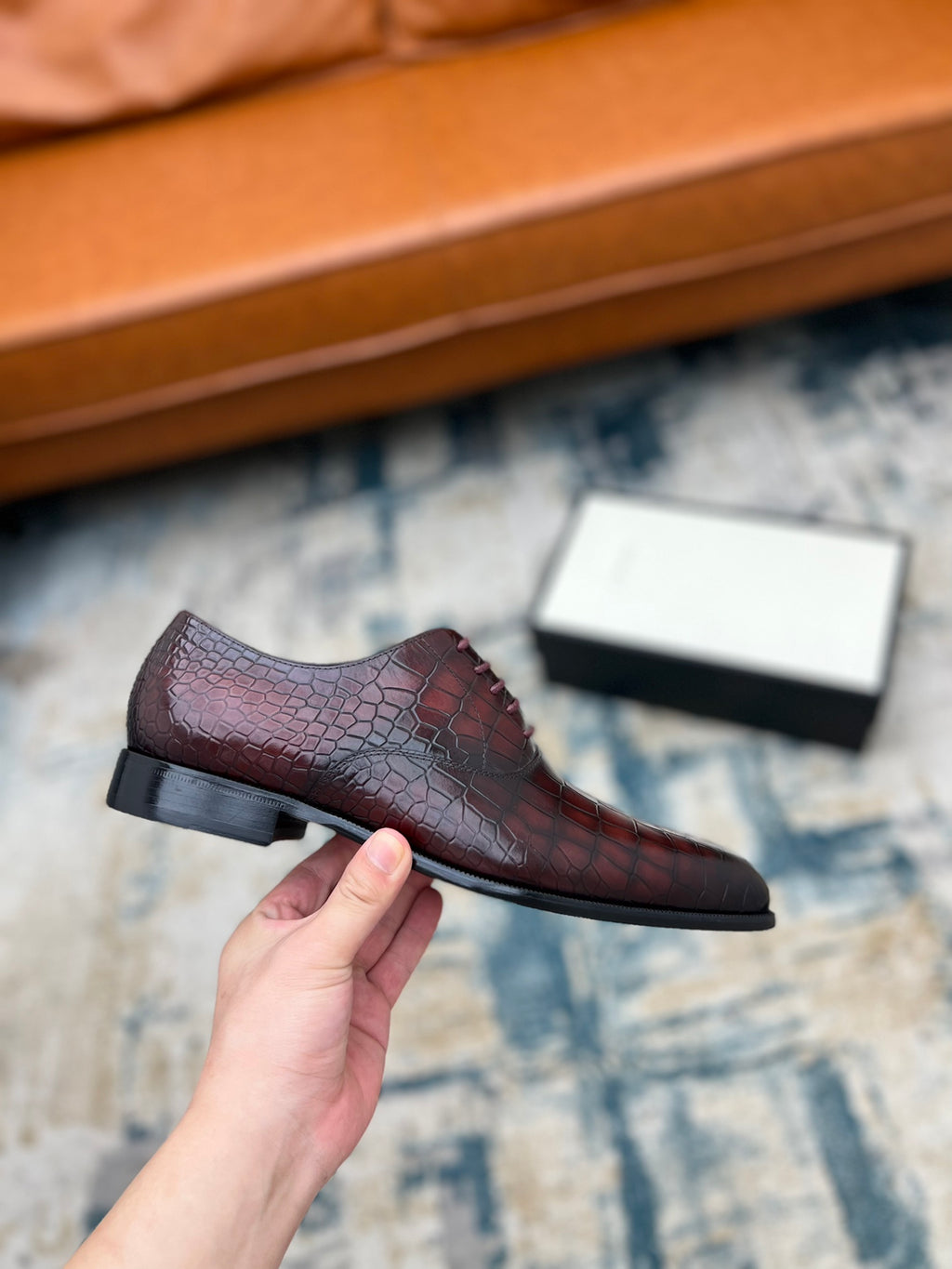 Single lace-up dress shoe, burgundy croc-textured leather, low block heel sole.