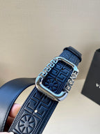 Navy leather belt with detailed embossed pattern and silver-tone buckle.