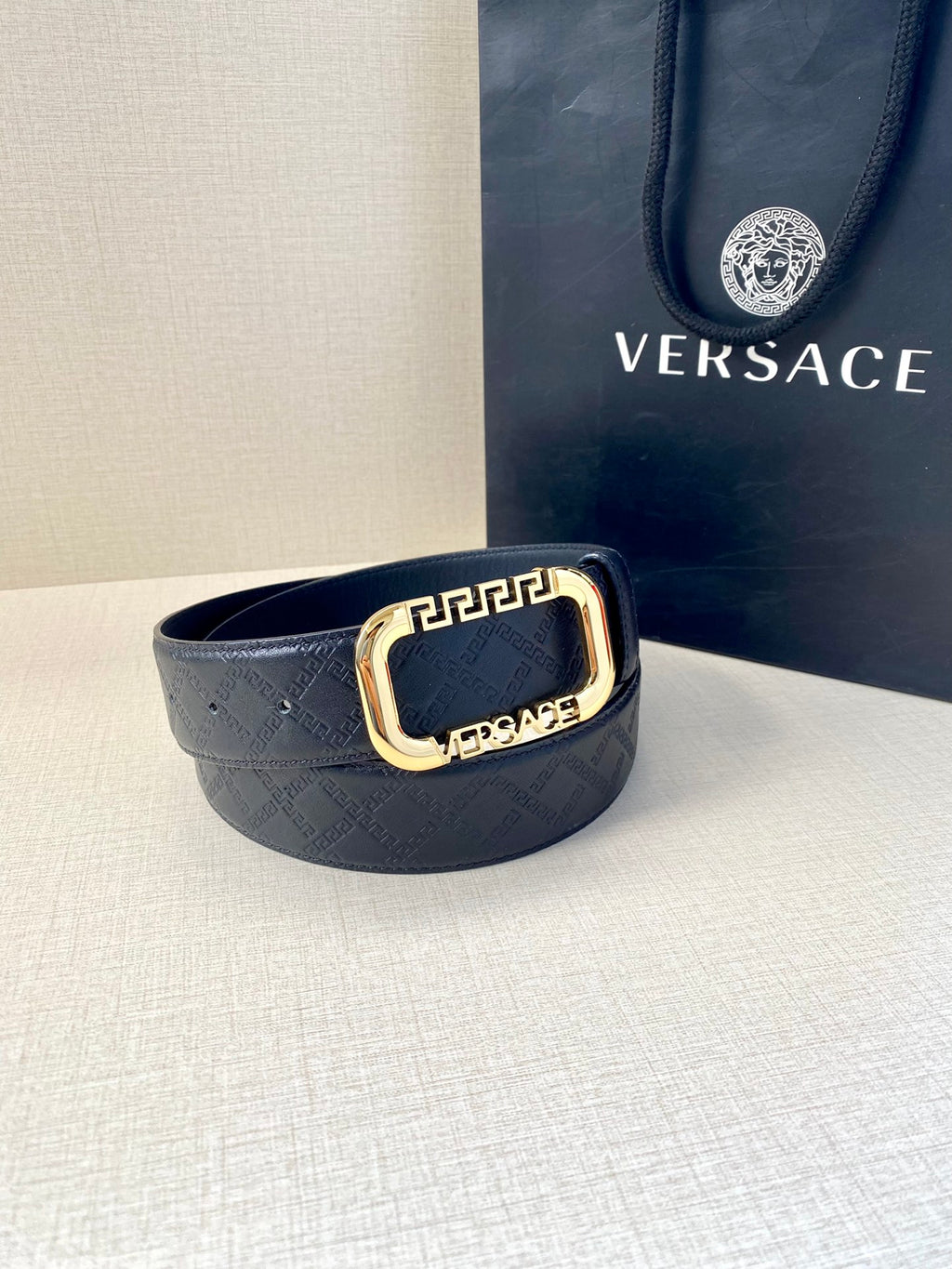Versace belt in dark blue with monogram texture and gold-toned buckle