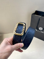 Versace belt strap with dark blue monogram pattern and gold-toned buckle, end visible