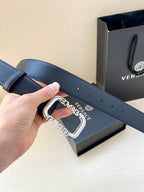 Versace leather belt with dark blue strap and gold-tone buckle with logo plate
