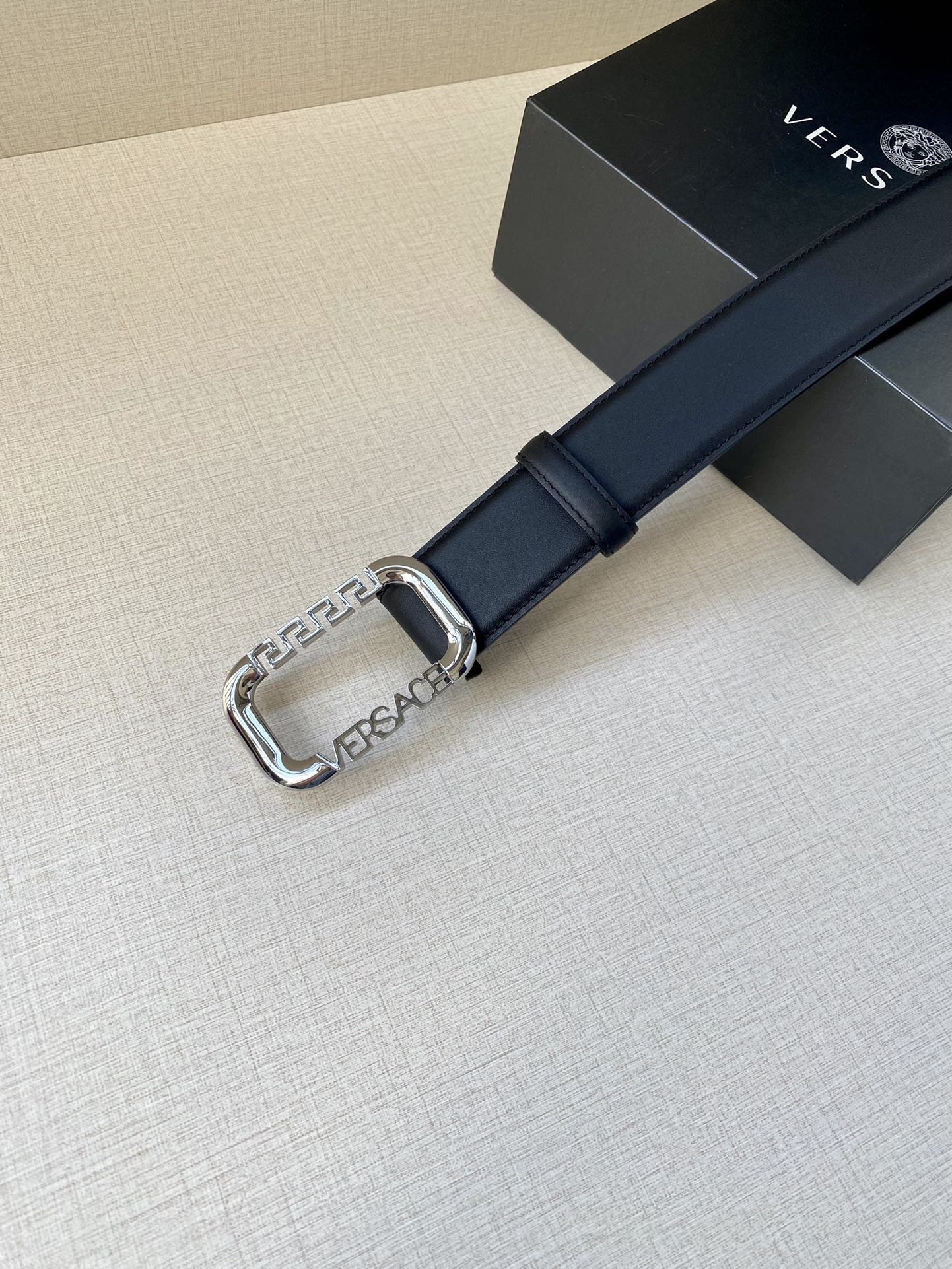 Versace leather belt in dark blue with silver-tone buckle and polished metal logo