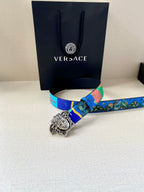 Versace belt lying flat with blue printed strap and silver-tone Medusa buckle