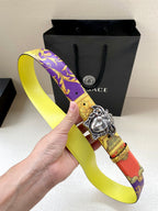 Versace belt in hand with silver Medusa buckle on yellow baroque purple red strap