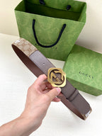 Gucci belt with dark brown leather strap and gold-tone interlocking double G buckle