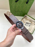 Gucci leather belt with dark brown strap and round GG buckle