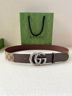 Gucci belt brown strap with GG monogram and silver double-G buckle, laid flat