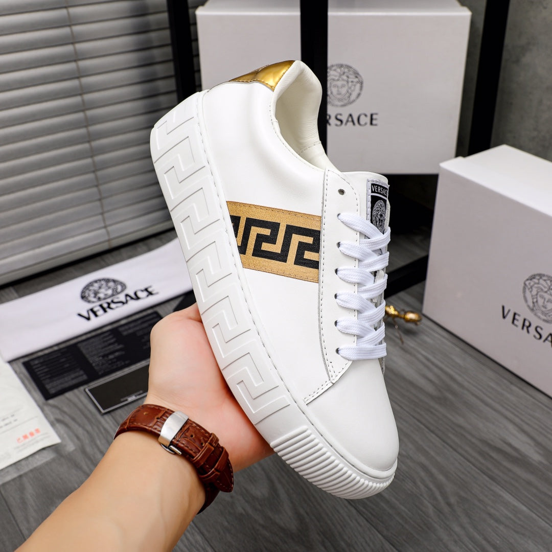 White leather sneaker with gold interior lining and gold logo strap detail