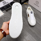 Shoe outsole view: white sneaker sole with textured pattern and sidewall