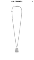Silver-tone chain necklace with small mesh bell pendant and 8B label