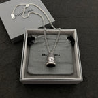 Silver-tone chain necklace with mesh bell pendant and logo charm, in box