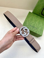 Gucci belt with light taupe leather strap and silver G logo buckle