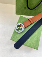 Gucci belt with tan strap and navy reverse, silver GG buckle and end holes
