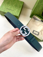 Gucci leather belt with teal strap and silver-tone interlocking logo buckle