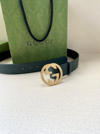 Teal leather belt with gold-tone interlocking logo buckle, front view