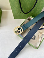 Teal leather belt with gold-tone interlocking logo buckle, side view