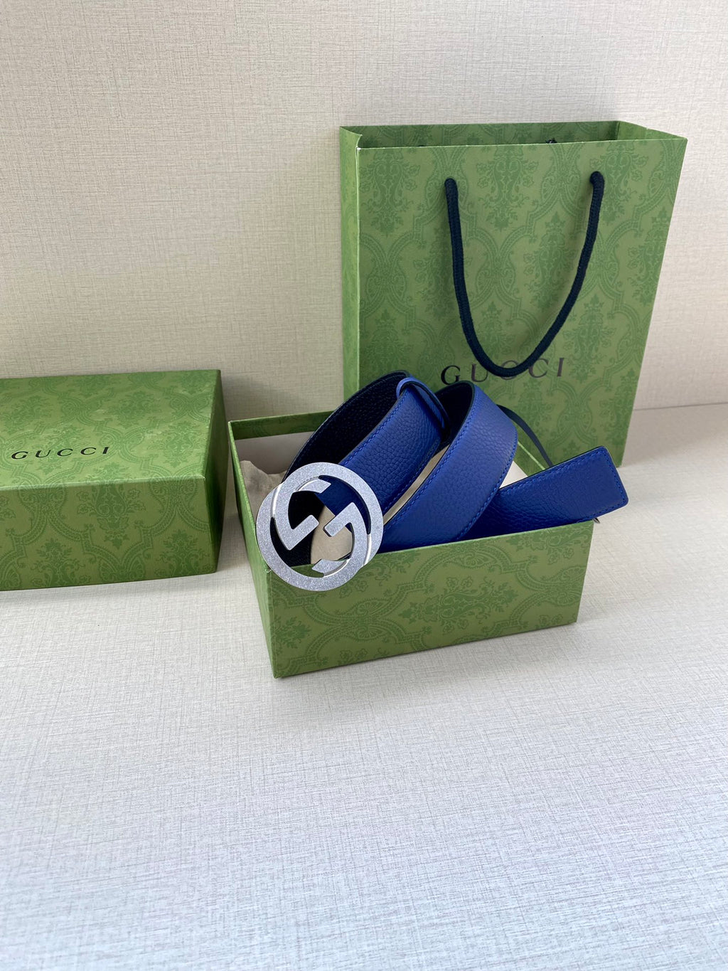 Gucci belt with blue leather strap and silver-toned GG buckle in gift boxes