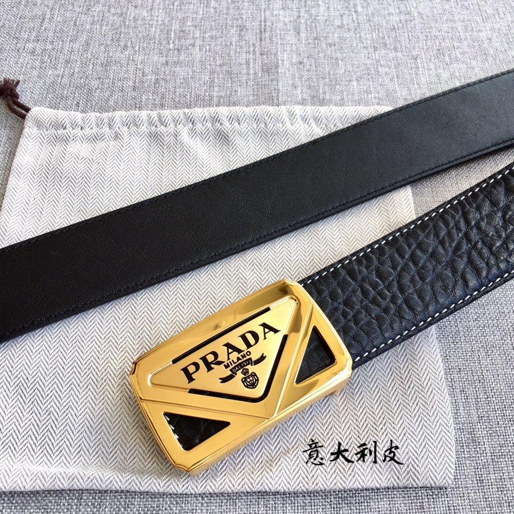 Prada belt buckle detail on dark leather strap with gold PRADA plate