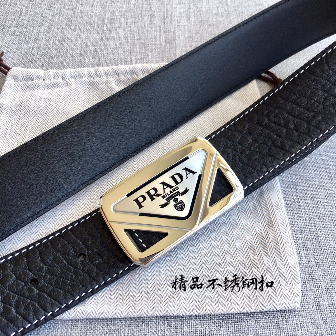 Prada belt with black textured leather and gold triangular logo buckle, angled view