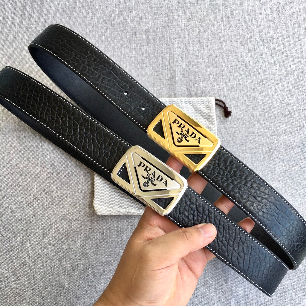 Prada leather belt pair with black straps and gold-toned triangular buckles