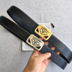 Prada leather belt pair with black straps and gold-toned triangular buckles
