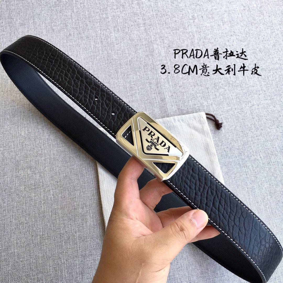 Prada leather belt with black strap and gold-toned triangular buckle in close-up