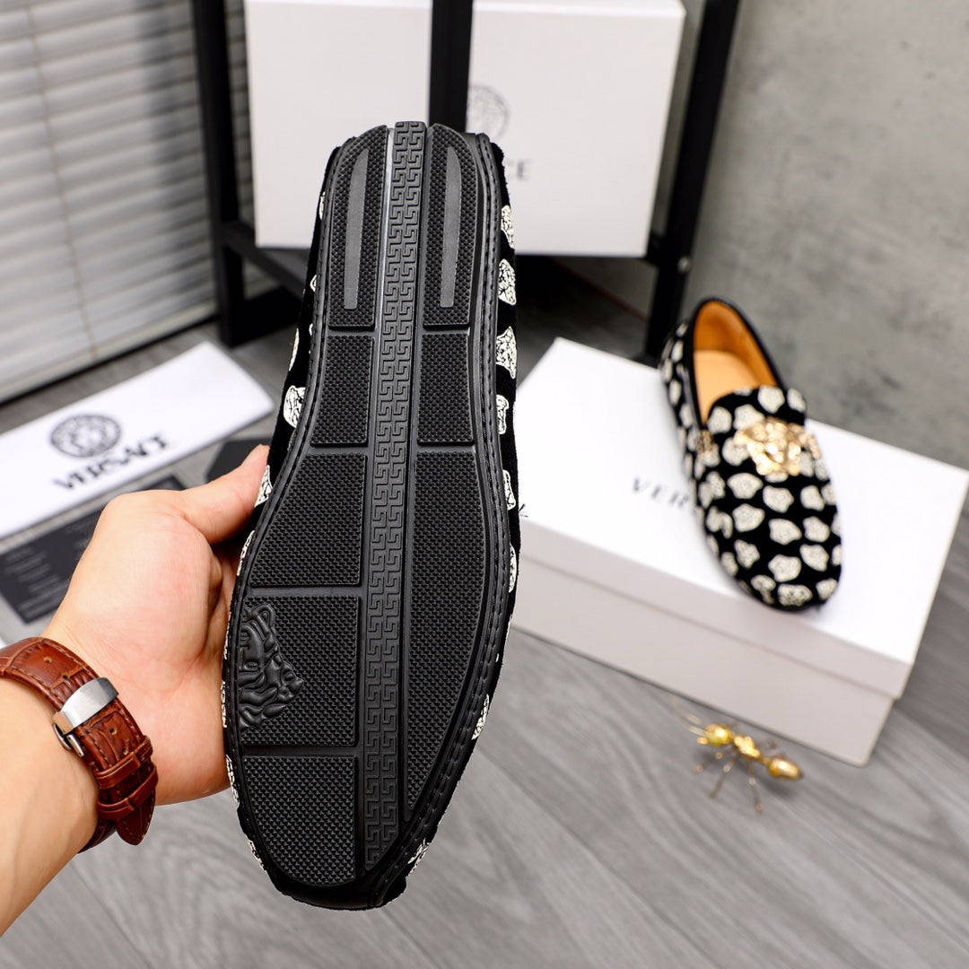 Versace luxury loafer outsole view, textured black tread with slip-on heel profile