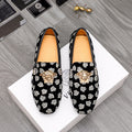 Versace luxury loafers, black slip-on with white patterned print and gold lion emblem