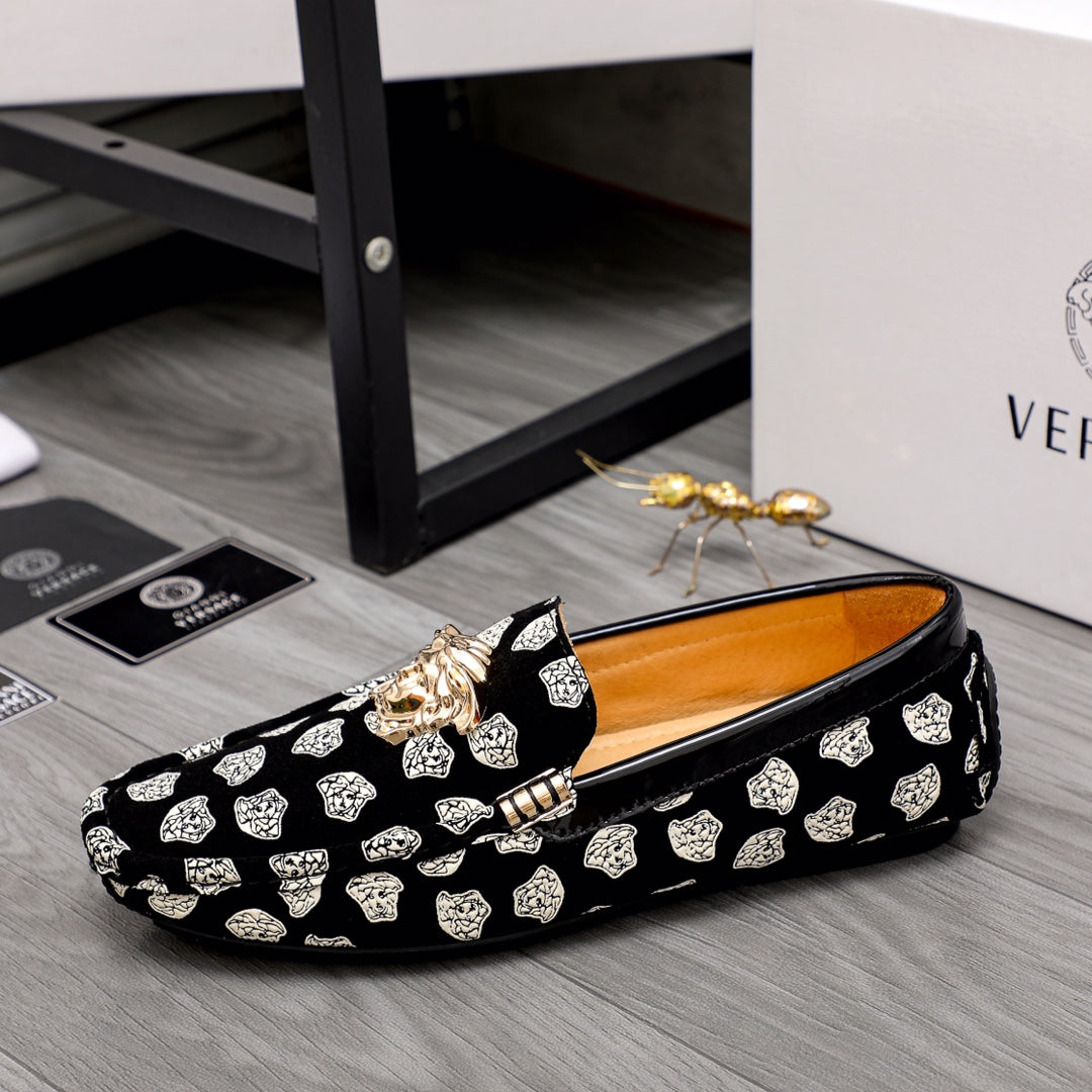 Versace luxury loafers, black slip-ons with white pattern print and gold lion ornament