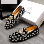 Versace luxury loafers set, black with white patterned print and gold lion head detail