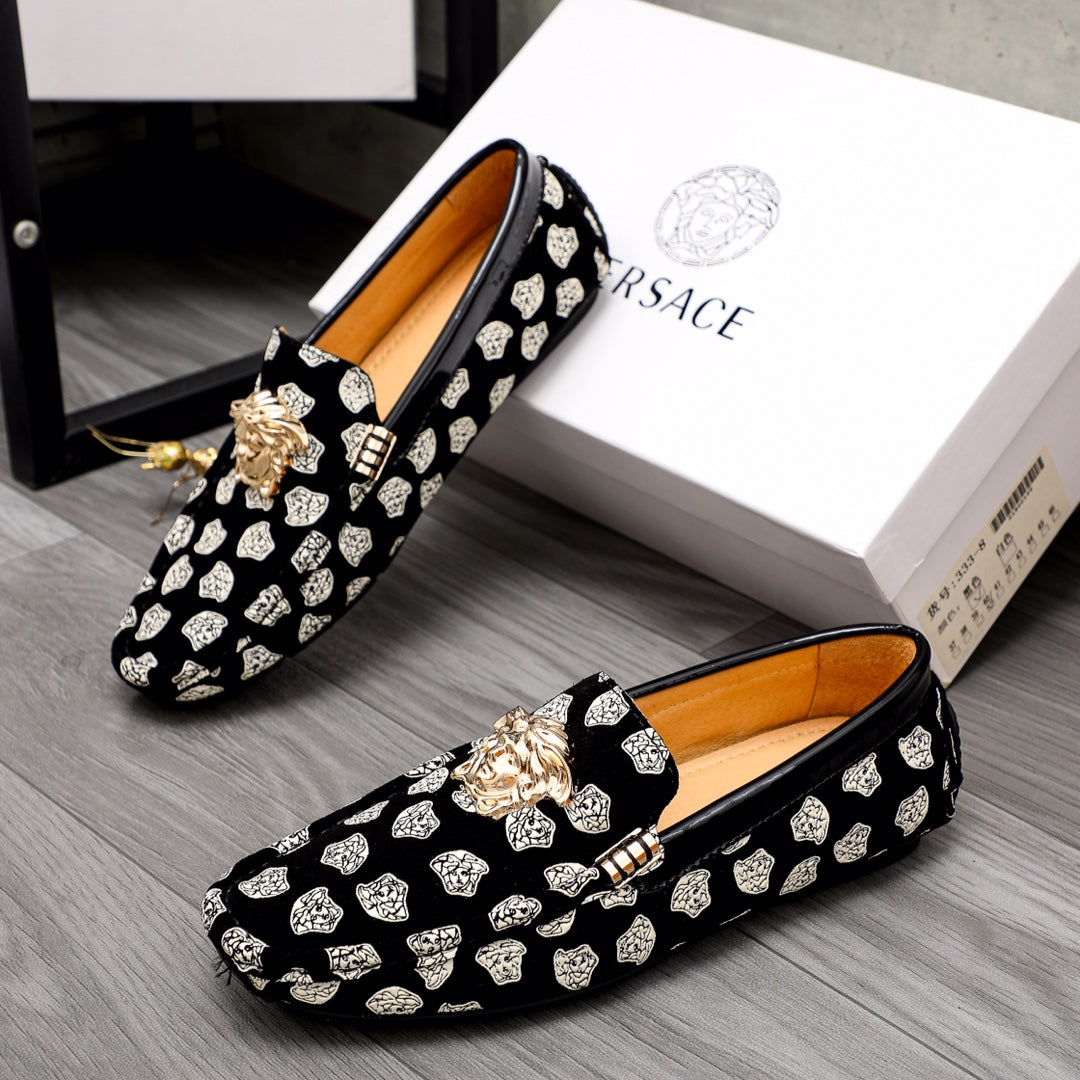 Versace luxury loafers set, black with white patterned print and gold lion head detail