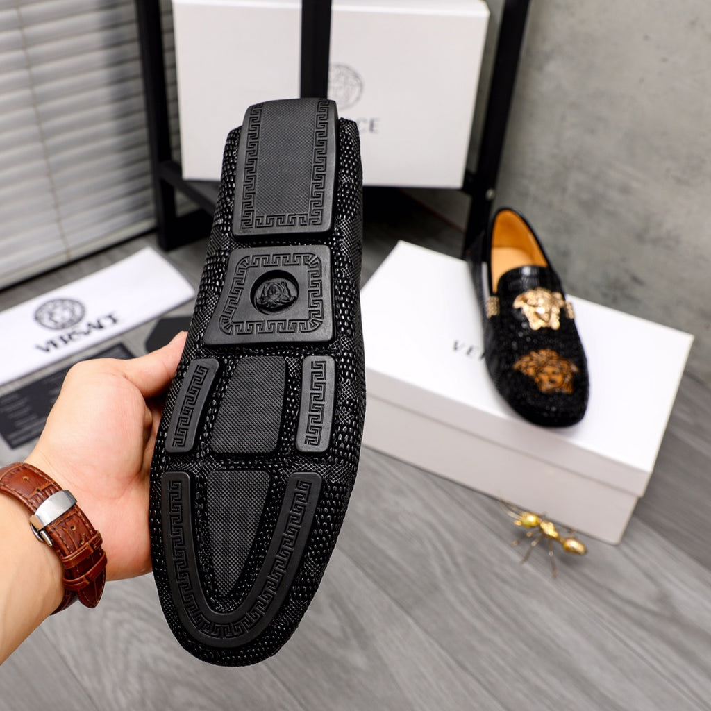 Black loafer sole and side view with Greek key pattern and Medusa logo