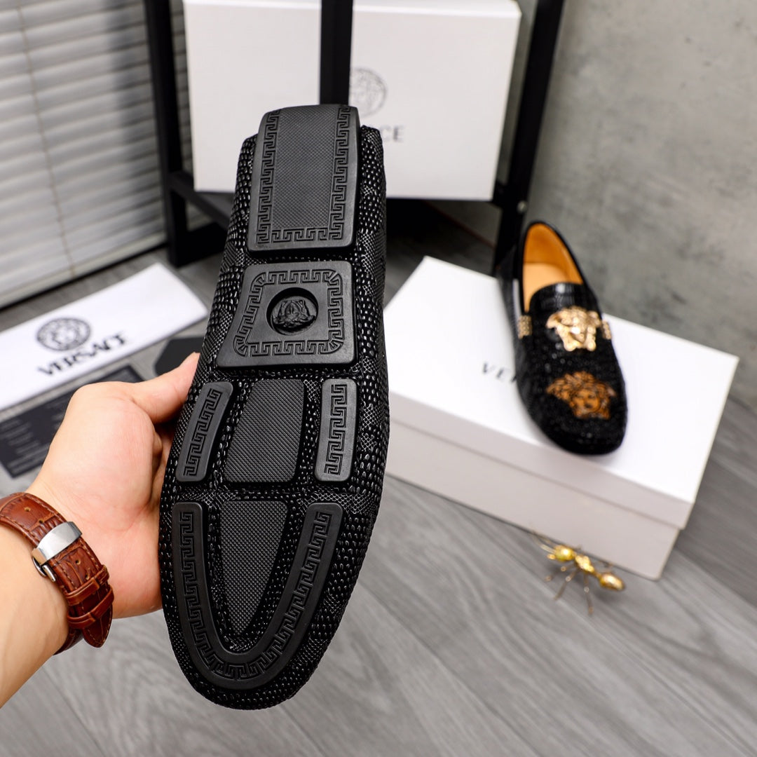 Black loafer sole and side view with Greek key pattern and Medusa logo