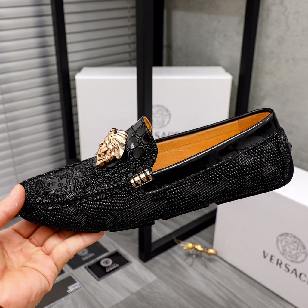 Versace black textured loafers with gold Medusa head detail, side view