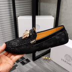 Versace black textured loafers with gold Medusa head detail, side view