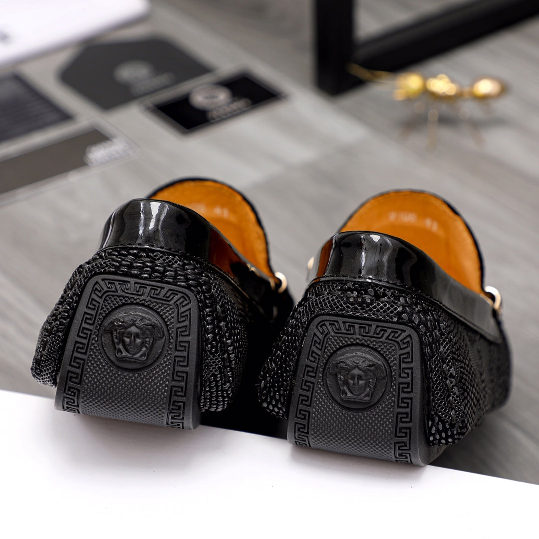 Versace black loafers heel view with embossed Medusa and Greek key pattern